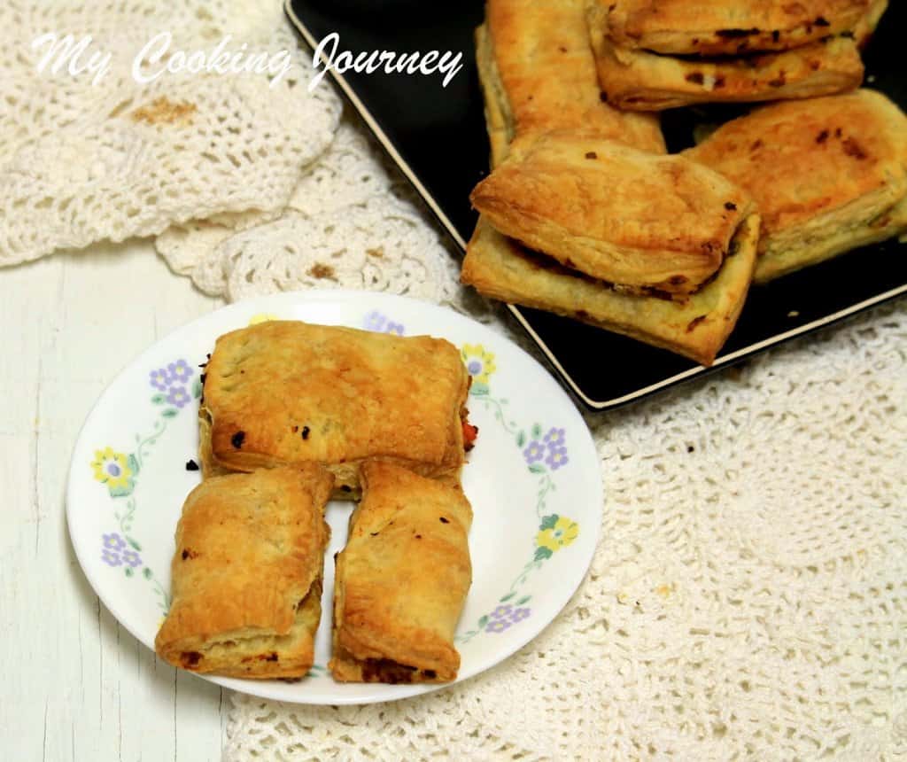 Vegetable Puff is served in a white plate