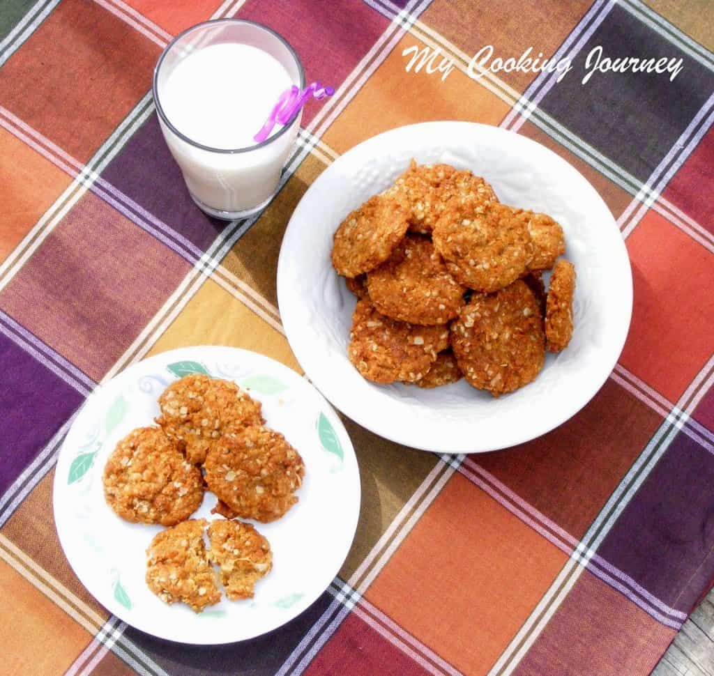 ANZAC cookies in a plate with milk