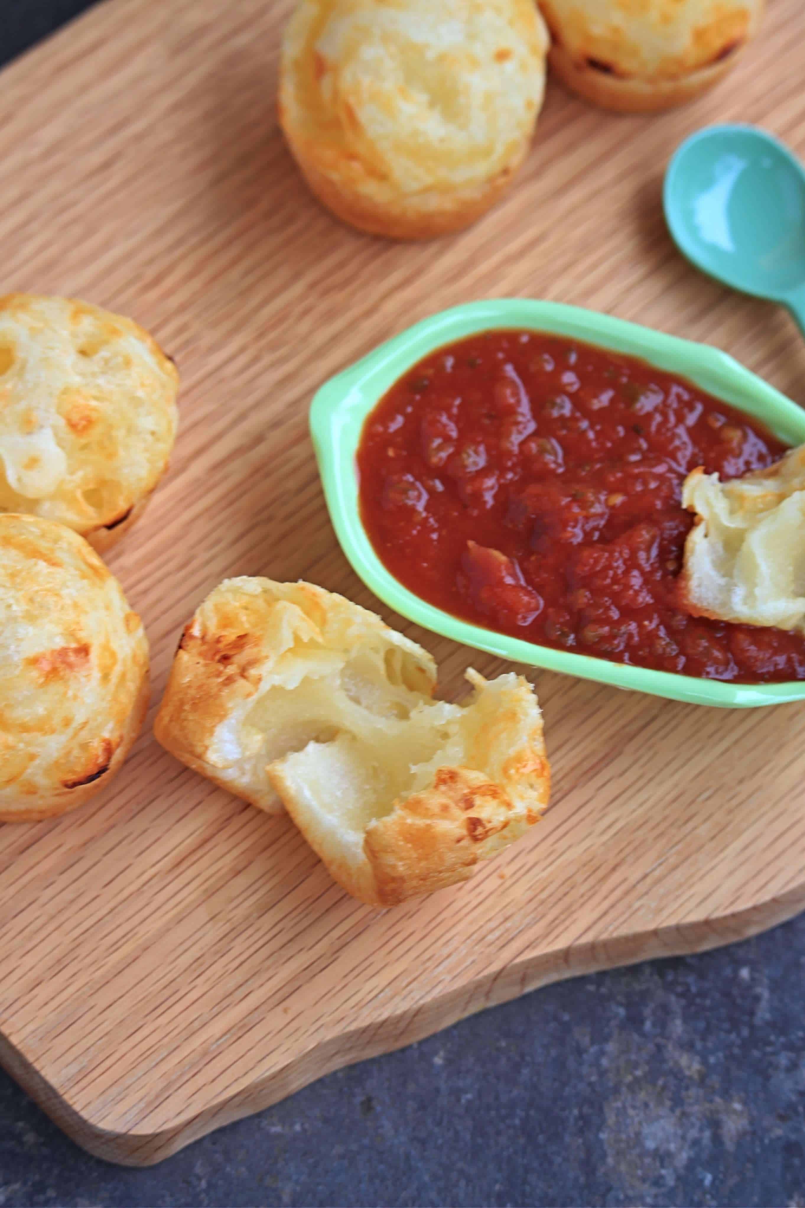 Pão de Queijo on a wooden board