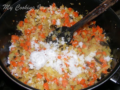 Adding coconut to the pan