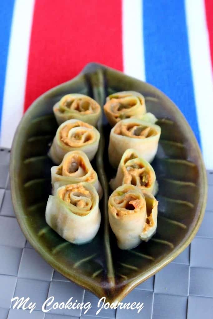 Cucumber Roll ups  served in a leaf designed bowl.