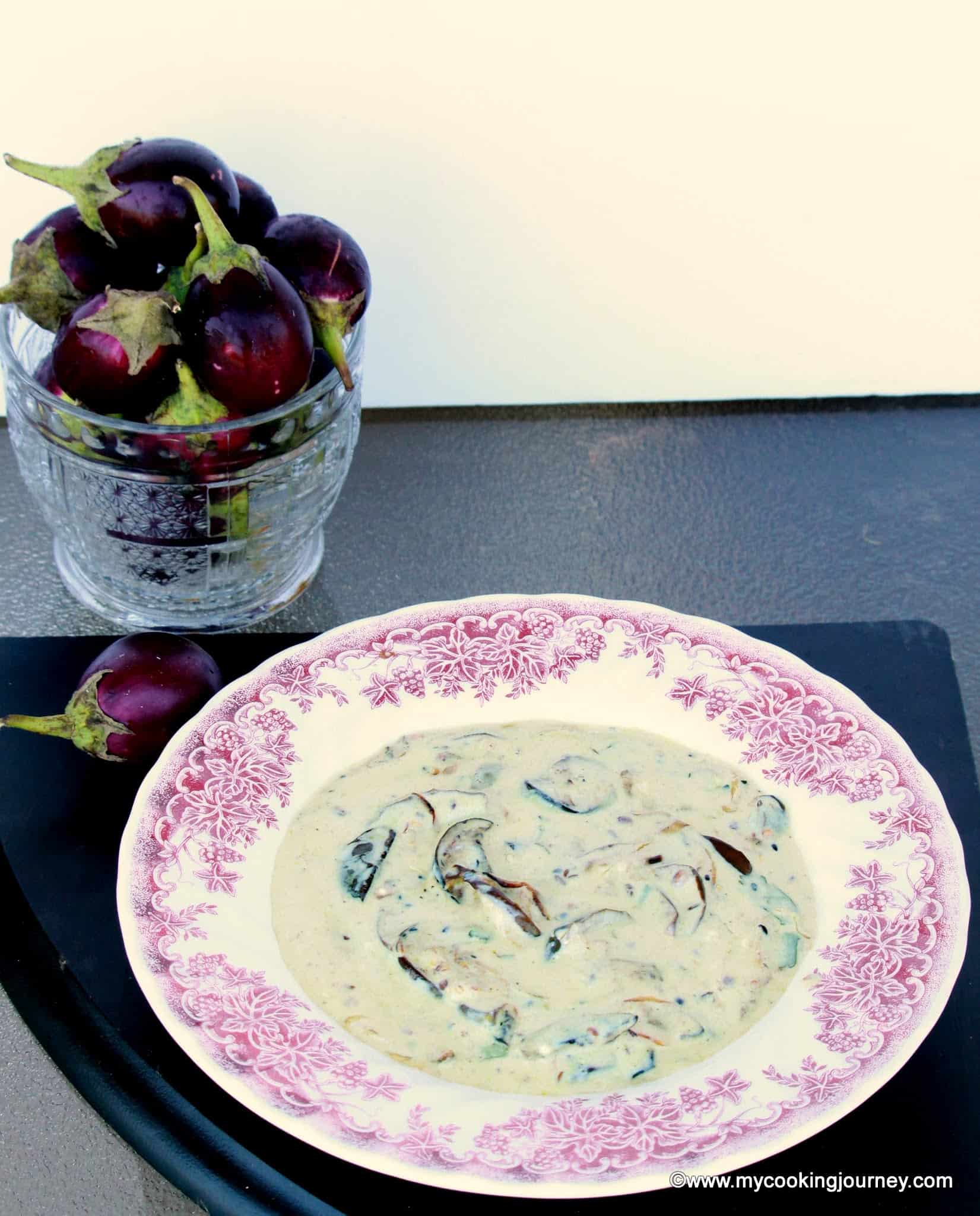 Dahi Baingana with eggplant in the background.