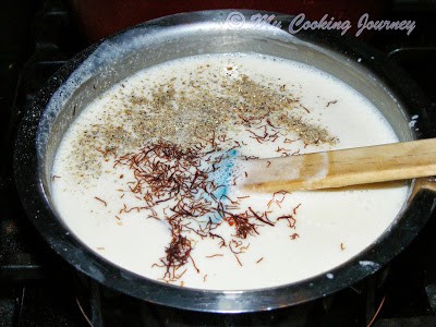 Adding saffron, cardamom powder to ice cream mixture