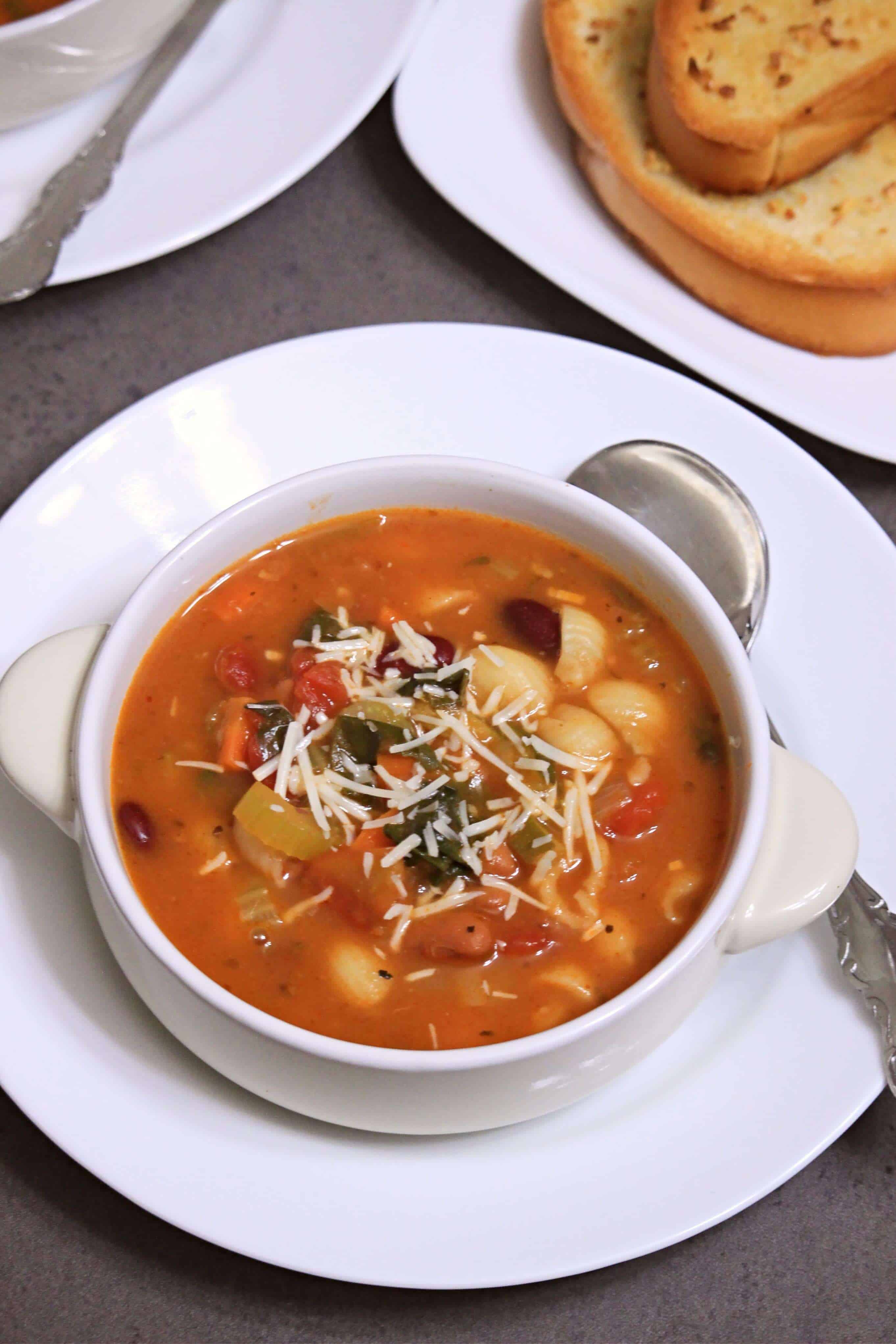 Minestrone soup in a bowl with cheese