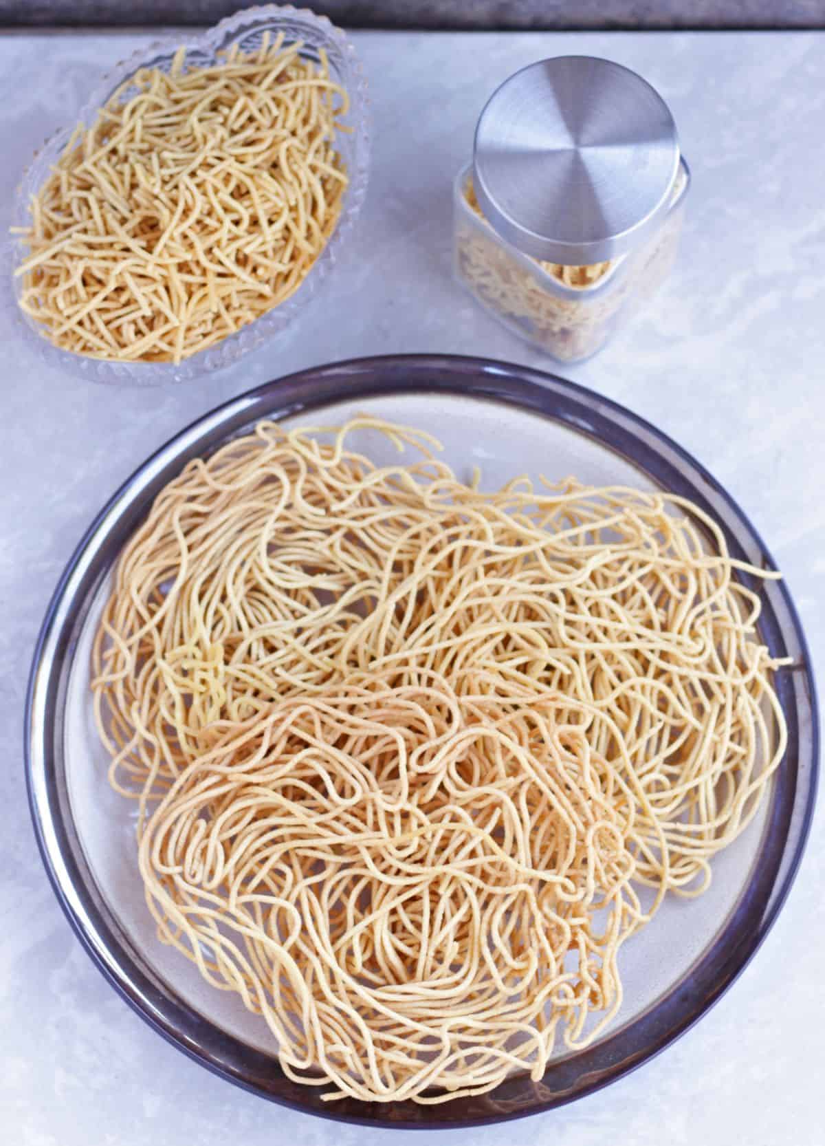 Omapodi prepared and in a plate and in a bowl