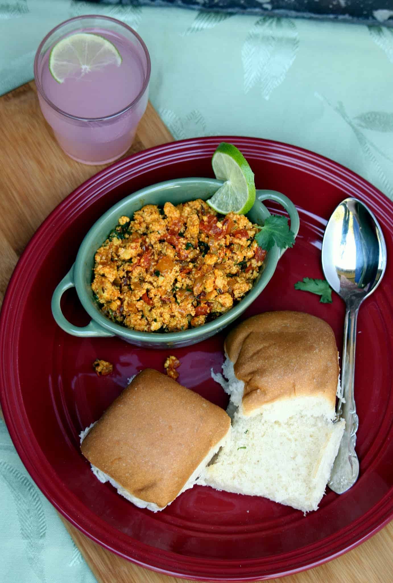 Paneer Bhurji with pav buns on the side along with pink lemonade. 