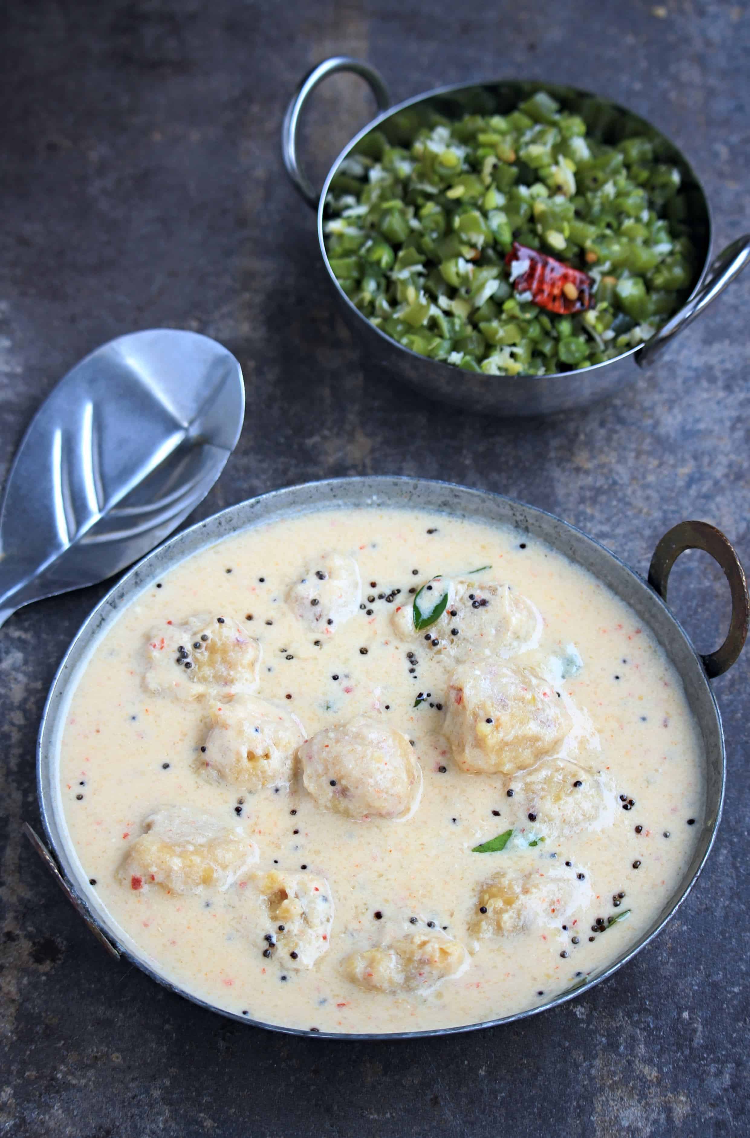 Buttermilk stew with lentil balls along with bean curry