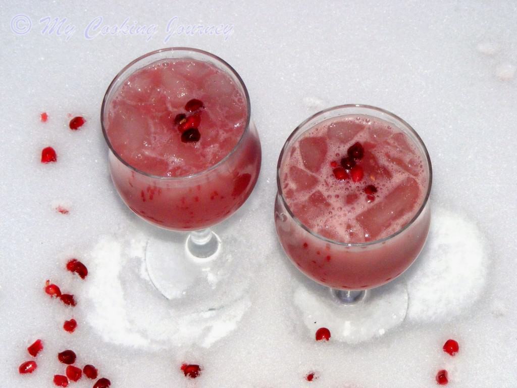 Pomegranate orange juice served in a glass with Pomegranate 