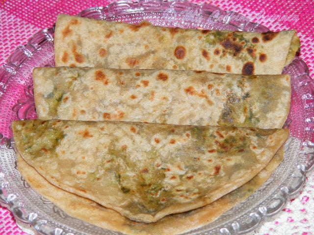 Stuffed Fenugreek Leaves Parata in a Glass plate