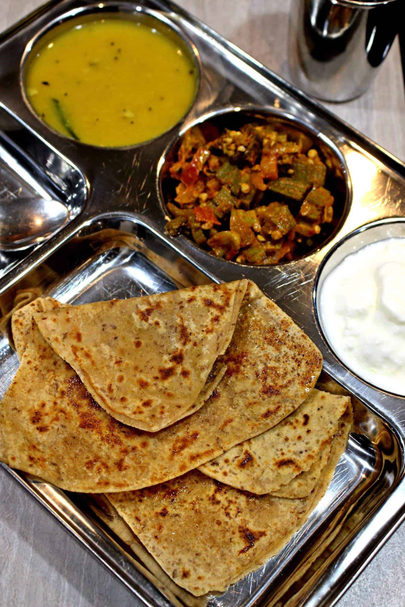 Sweet Paratha on a stainless steel plate