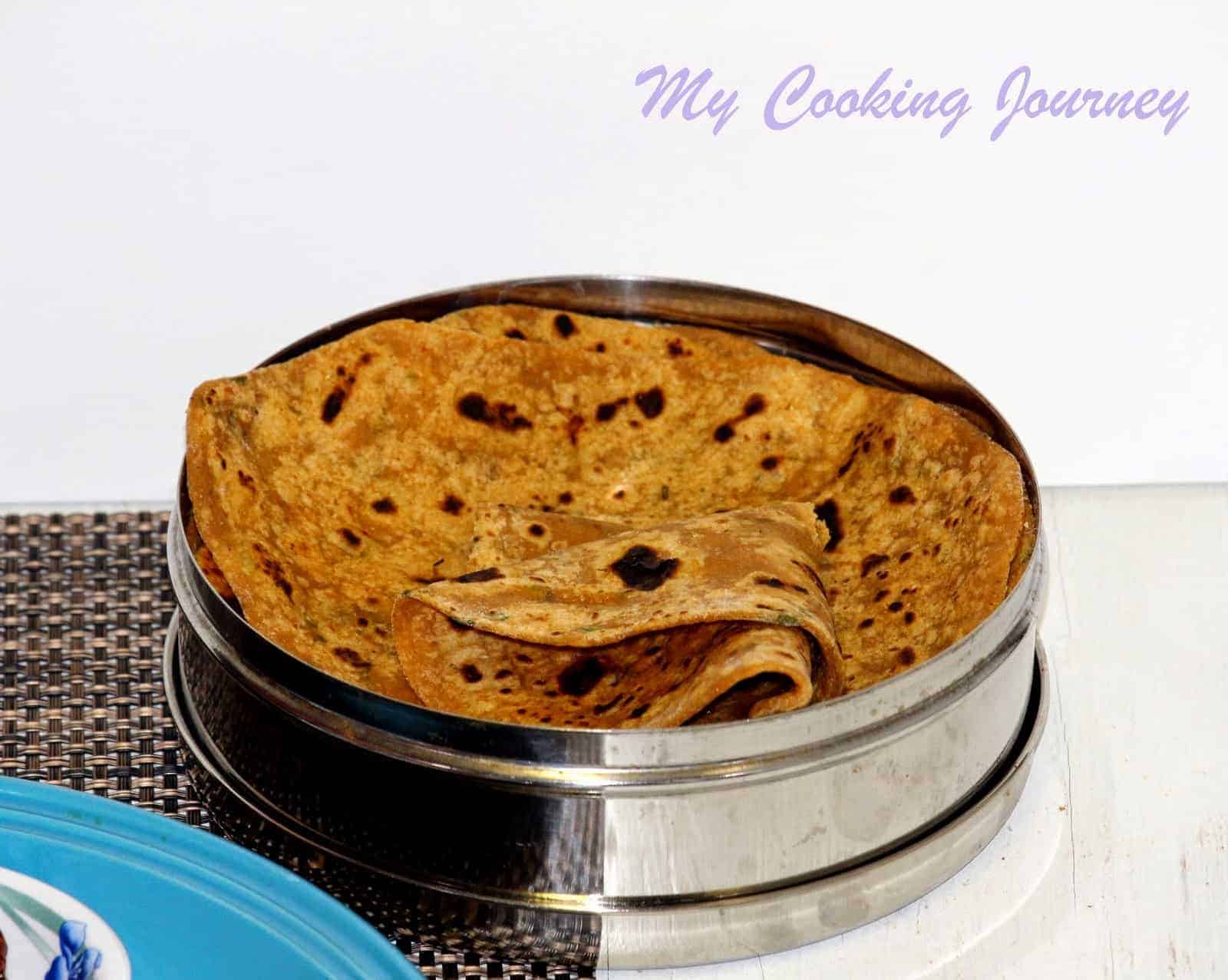 Sweet Potato Paratha in a steel box