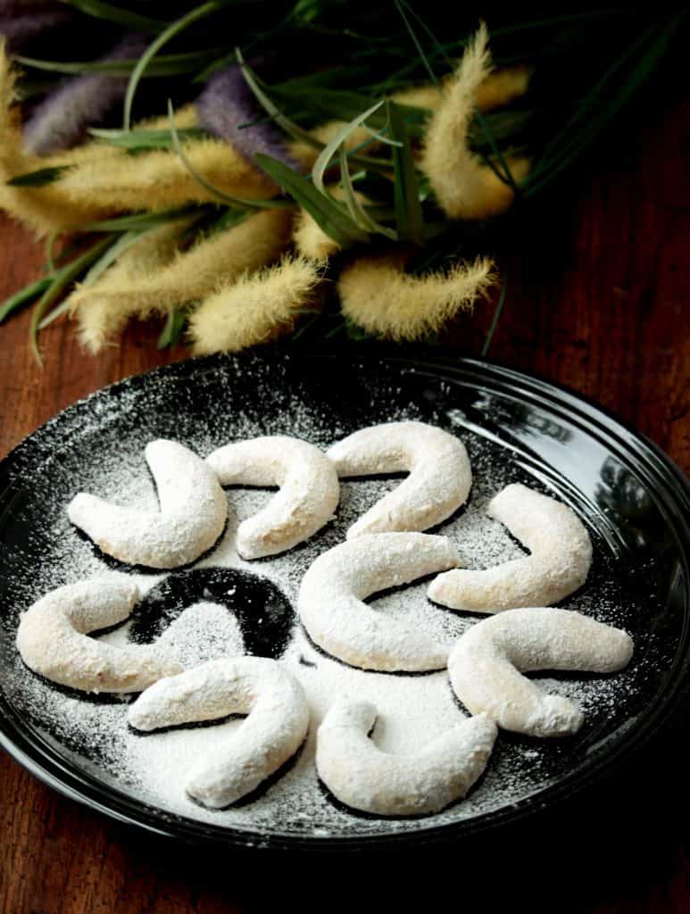 Austrian Vanilla Crescent Cookies in a black plate